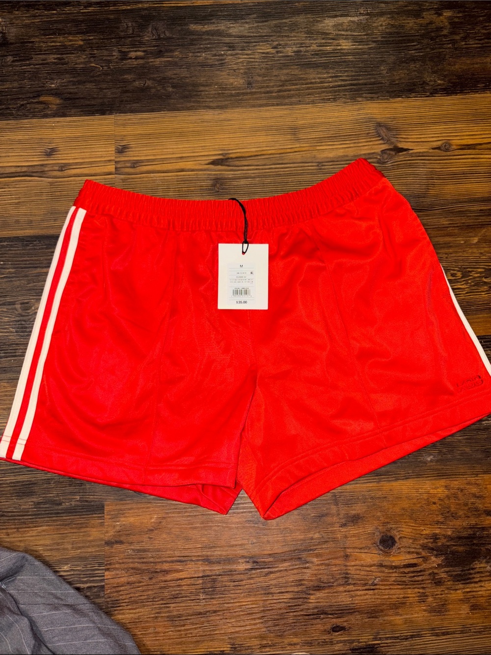 Red Athletic Shorts with White Side Stripes